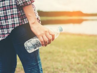 close-up-of-hand-holding-a-plastic-bottle_1150-420