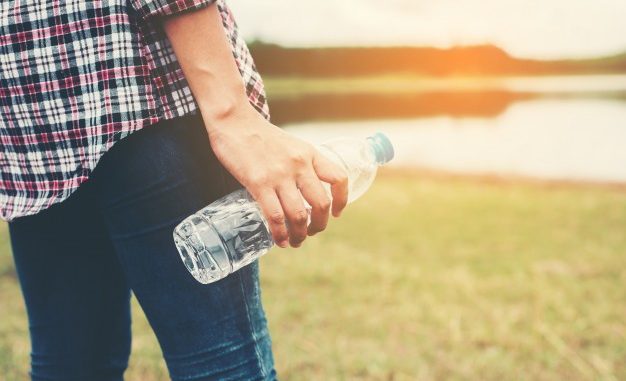 close-up-of-hand-holding-a-plastic-bottle_1150-420