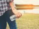 close-up-of-hand-holding-a-plastic-bottle_1150-420